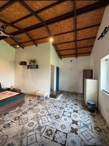 a room with a bed and a tile floor at Rathi property in Gurgaon