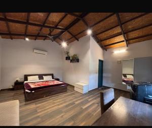 a room with a bed and a table in it at Rathi property in Gurgaon