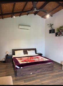 a bedroom with a large bed in a room at Rathi property in Gurgaon