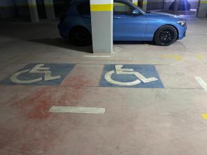 a blue car is parked in a parking garage at App de luxe sur complexe ATANMIYA de MARTIL in Martil