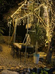 a patio with a table and a bunch of lights at Tình's Homestay in Ninh Binh