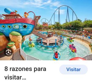 a screenshot of a water park at a theme park at apartamento cerca playa ,estación tren y garaje gratis in Segur de Calafell