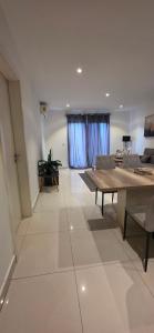 a living room with a table and a couch at The Lennox Premier Suites in Accra