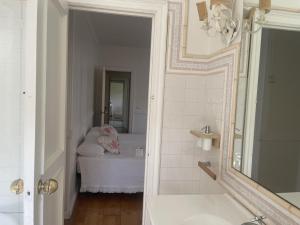 a bathroom with a tub and a sink and a mirror at Casa Sierrapando - by Wehomes in Torrelavega +42 photos