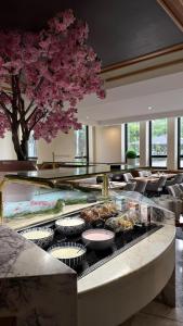 a buffet in a hotel with food on a table at guestified GRAND AIRPORT Hotel Düsseldorf Ratingen in Ratingen