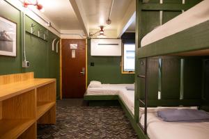 a room with two bunk beds in it at The Hostel in Teton Village