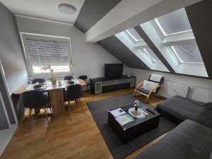a living room with a couch and a table at DenVigo in Čakovec