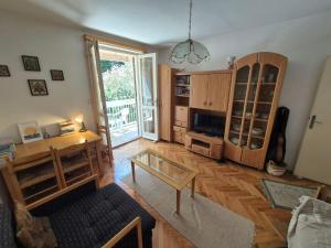 a living room with a table and a glass table at Drača in Savina