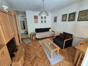 a living room with a couch and a table at Drača in Savina