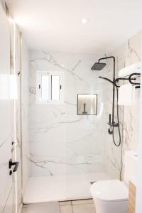 a white bathroom with a shower and a toilet at Viceda Home in Yecla +63 photos