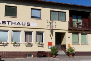 a building with a sign that reads ashrams at Gästehaus Franz in Kroatisch Geresdorf