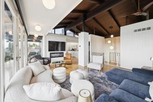 a living room with a couch and a table at Luxe Mt Adams Lookout in Cincinnati