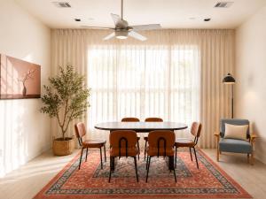 a dining room with a table and chairs at Houston House Downtown Stays - Free Parking in Houston +12 photos