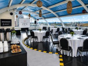 a banquet hall with white tables and chairs in it at Zen Hotel Boutique in Bogotá