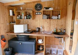 a kitchen with a counter and a sink in a room at Refugio del Lago in Seekirchen am Wallersee
