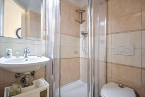 a bathroom with a shower and a sink and a toilet at Albergo Al Carugio in Monterosso al Mare +165 photos