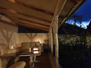 a living room with a couch and a table at Casa Luna Betiluna in Ciclova-Montană