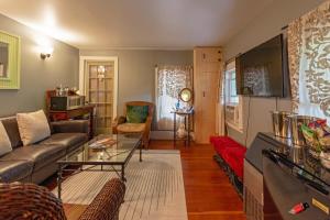 a living room with a couch and a table at The Woodbine Inn in Palenville