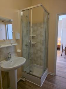 a bathroom with a sink and a glass shower at Maison Lanty in Lanty +18 photos