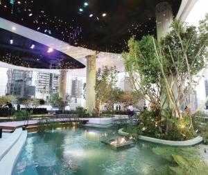 a pool in the lobby of a building at CASA Sukhumvit 39 - สุขุมวิท 39 in Klong Toi