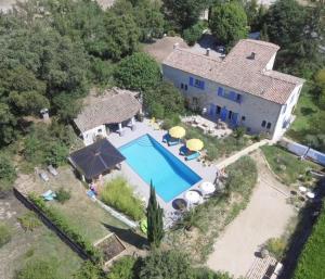 an aerial view of a house with a swimming pool at Yourte piscine jacuzzi in Gréoux-les-Bains