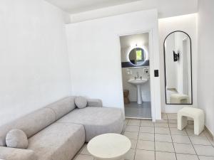 a living room with a couch and a sink at Studio Popi in Marathokampos +35 photos