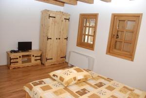 a bedroom with a bed and a tv on a table at Balkis Resort in Bakinci