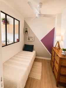 a bedroom with a bed and a window at Between Caribean Seas in Cul de Sac