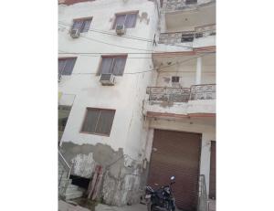 a motorcycle parked in front of a building at Hotel Viren Sofitel, Agra in Agra