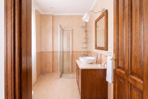 a bathroom with a sink and a shower at Alayaz Hotel in Alaçatı +56 photos