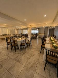 a large banquet hall with tables and chairs at Meson de la Merced in Zacatecas