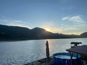 a view of the sun setting over a lake at Lure House in Mali Zvornik