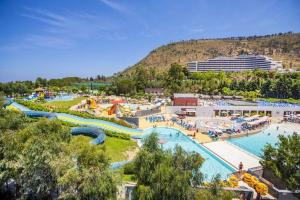 a large water park with a pool and slides at Nel Corso del Sogni Sicily Center Rooms in Campofelice di Roccella