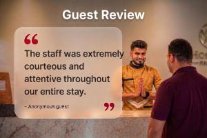 a sign that says the staff was extremely courprofessional and attentive throughout our entire stay at Hotel O Calcutta University Formerly Hamza International in Kolkata