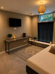 a bedroom with a table with a coffee maker on it at Boutique Hotel Mare in Middelburg