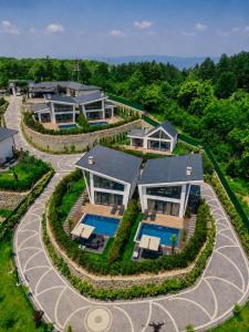 an aerial view of a house with a swimming pool at Nish Vadi Villas in Sapanca