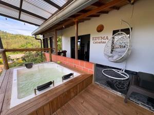 a jacuzzi tub in a house with at EDYMA Cabaña con JACUZZI in Guatapé