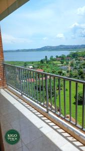 a balcony with a view of the water at Kigo Perch in Kampala