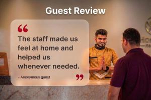 a sign that says the staff made us feel at home and helped us whenever we at Super Hotel O Namakkal in Nāmakkal