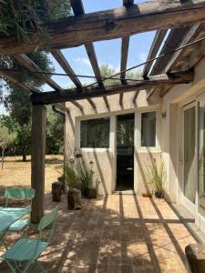 a patio with a wooden pergola at Il Respiro degli Ulivi in Viterbo