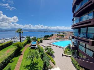 a view of a building and a swimming pool at Milazzo. Intero alloggio in affitto in Milazzo