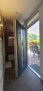 an open door of a house with a patio at Appartement Dollnig in Flattach
