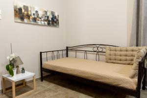 a bedroom with a bed and a side table at Mani Spot Casa Elia in Areopoli