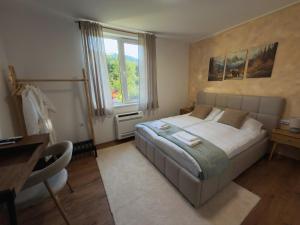 a bedroom with a large bed and a window at Villa Maria in Ribarica +84 photos
