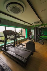 a gym with a treadmill and ellipticals in a room at Grand Mercure SP Pinheiros in São Paulo +68 photos