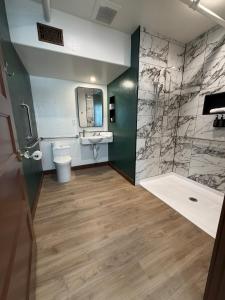 a bathroom with a toilet and a sink at Historic Tomahawk in Green River +41 photos