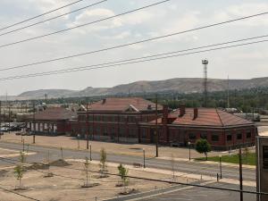an empty street in front of a large brick building at Historic Tomahawk in Green River