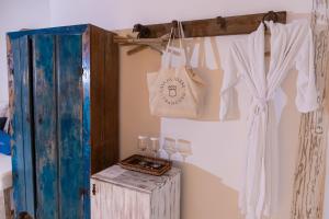 a room with a clothesline with clothes hanging up at Casa La Torre Hotel Boutique in Trancoso