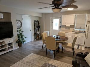 a living room with a table and chairs and a kitchen at Cozy Hideaway guest suite in Midlothian