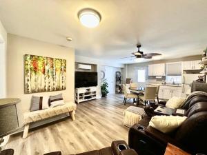 a living room with a couch and a dining room at Cozy Hideaway guest suite in Midlothian
